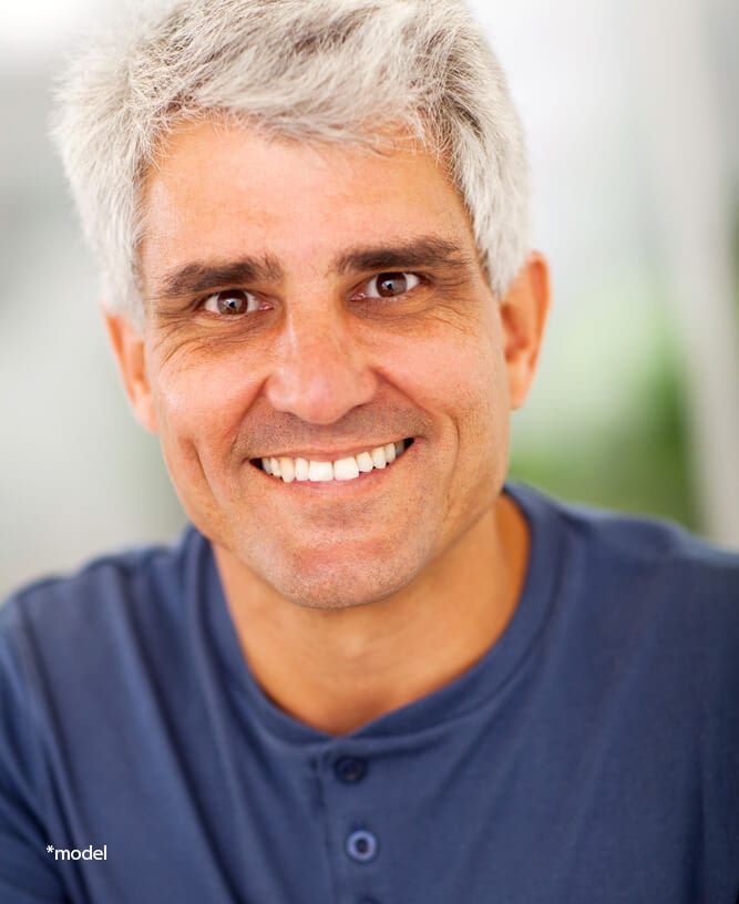 Mature man smiling at camera.