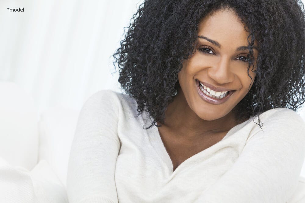 Woman with a beautiful smile looking at camera.