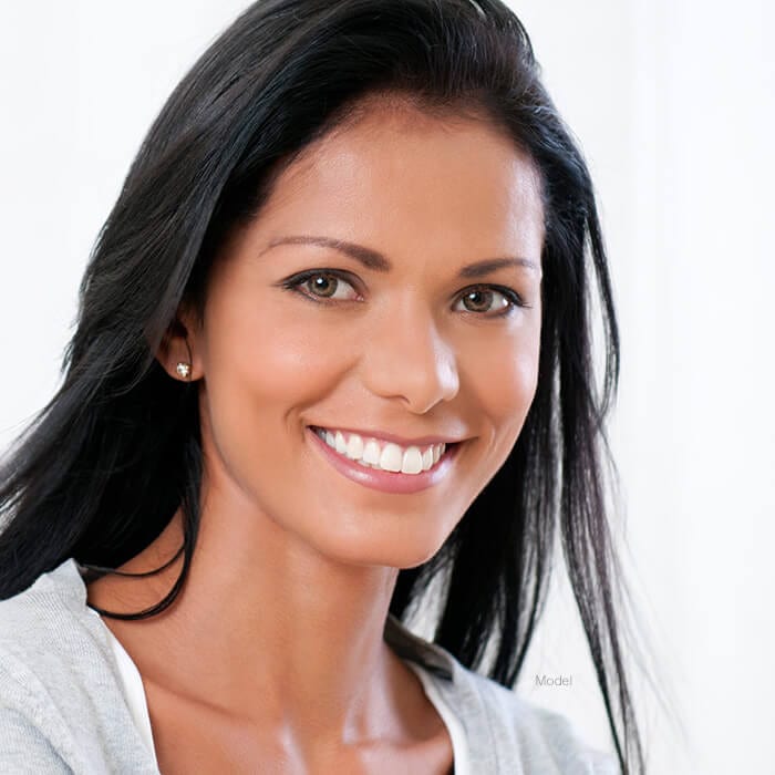 Woman with dark hair smiling