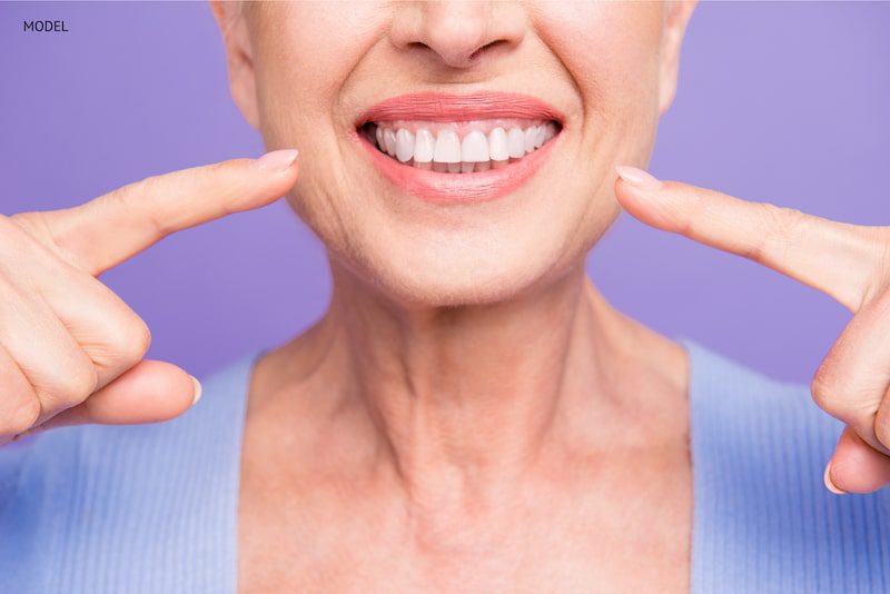 older woman with healthy teeth and youthful smile.