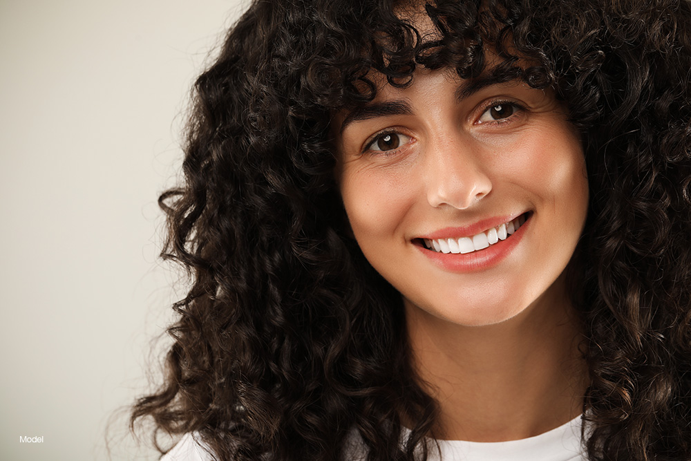 Woman with curly hair smiling
